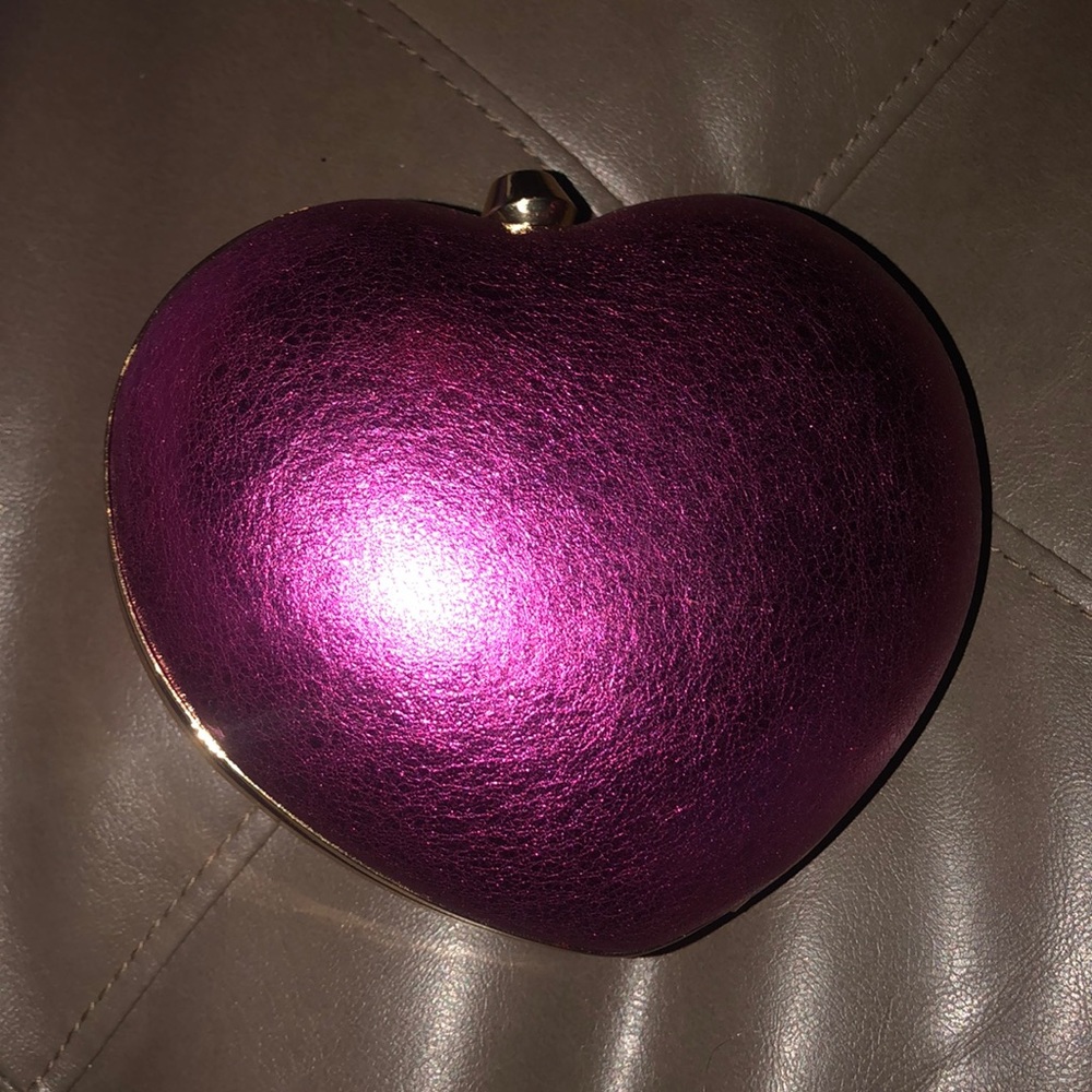 Michael kors hot pink heart shape clutch.
